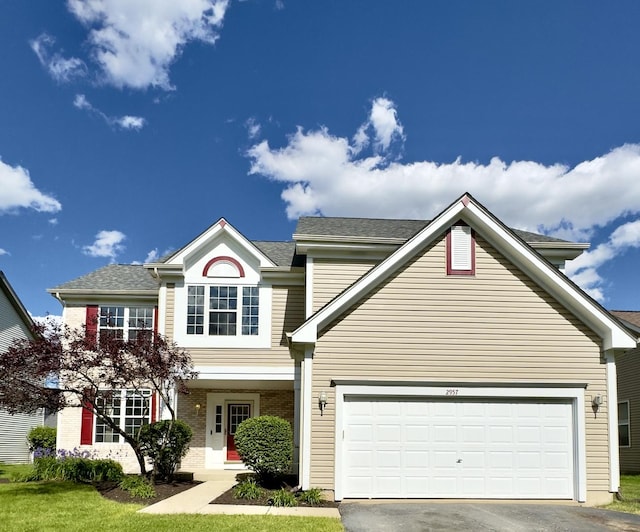 2957 Savannah Dr, Aurora, IL 60502 - traditional-style house with driveway, an attached garage, and brick siding