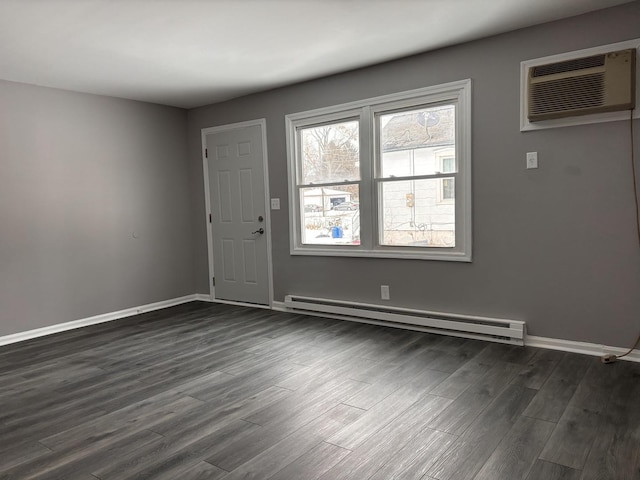 foyer with baseboards, baseboard heating, dark wood finished floors, and a wall mounted air conditioner