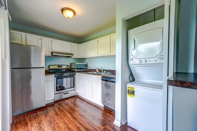 109 Gant Cir Unit B, Streamwood, IL 60107 - kitchen with under cabinet range hood, dark wood-style flooring, a sink, stacked washing maching and dryer, and appliances with stainless steel finishes