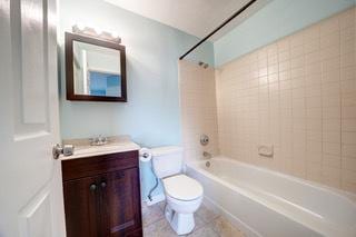 109 Gant Cir Unit B, Streamwood, IL 60107 - bathroom featuring toilet, washtub / shower combination, and vanity