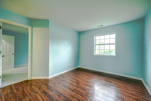 109 Gant Cir Unit B, Streamwood, IL 60107 - spare room featuring visible vents, baseboards, and dark wood-type flooring