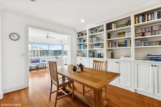 dining area with ornamental molding, light wood-type flooring, ceiling fan, and recessed lighting
