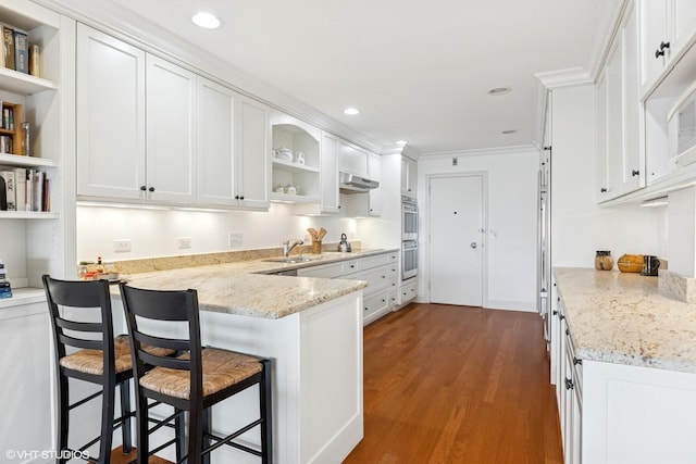 kitchen with open shelves, white cabinetry, a sink, dark wood finished floors, and recessed lighting