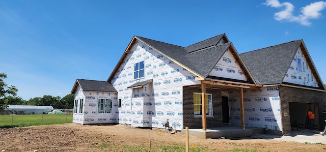 24415 W Quail Dr, Channahon, IL 60410 - view of property exterior with brick siding and roof with shingles