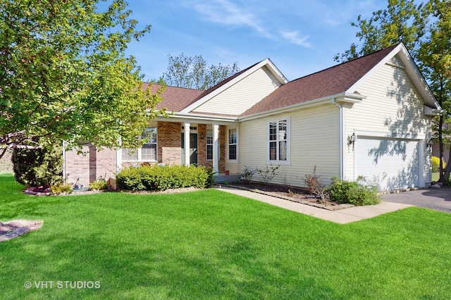 376 Willow Rd, Lakemoor, IL 60051 - view of front facade with a front lawn, driveway, and a shingled roof