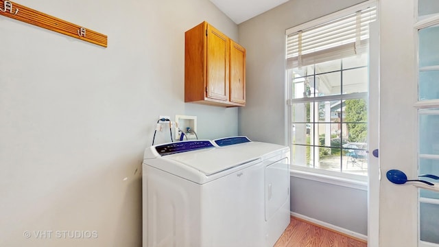 376 Willow Rd, Lakemoor, IL 60051 - laundry room with cabinet space, light wood-style floors, and independent washer and dryer