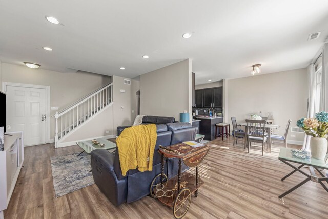 8529 Sawyer Ct, Joliet, IL 60431 - living area featuring stairway, light wood-type flooring, and recessed lighting