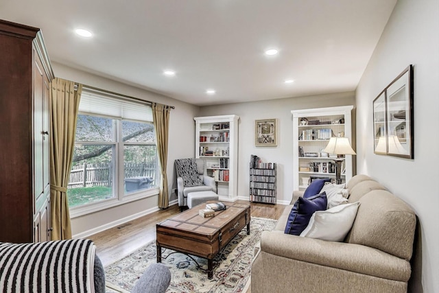 962 Thompson Blvd, Buffalo Grove, IL 60089 - living room with wood finished floors, recessed lighting, and baseboards
