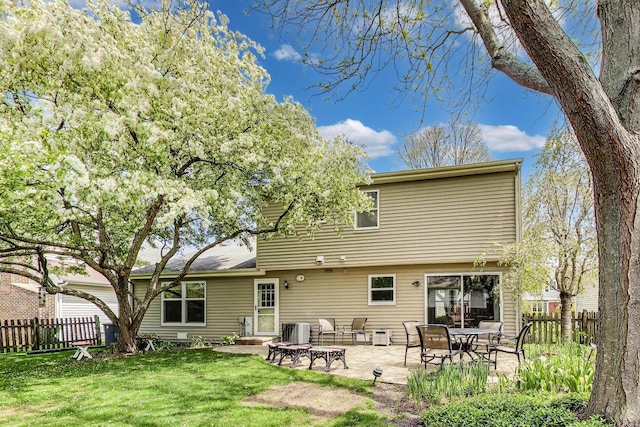 962 Thompson Blvd, Buffalo Grove, IL 60089 - rear view of house with central AC and a patio area