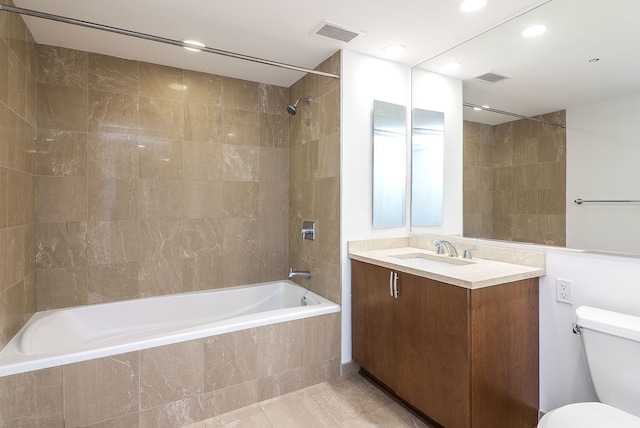 60 E Monroe St Unit 2705, Chicago, IL 60603 - bathroom with tiled shower / bath combo, toilet, tile patterned flooring, vanity, and recessed lighting