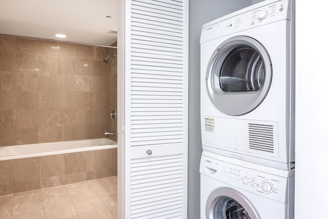 60 E Monroe St Unit 2705, Chicago, IL 60603 - laundry room featuring stacked washer / dryer, tile patterned flooring, and recessed lighting