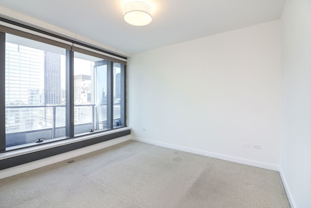 60 E Monroe St Unit 2705, Chicago, IL 60603 - empty room featuring light colored carpet and baseboards