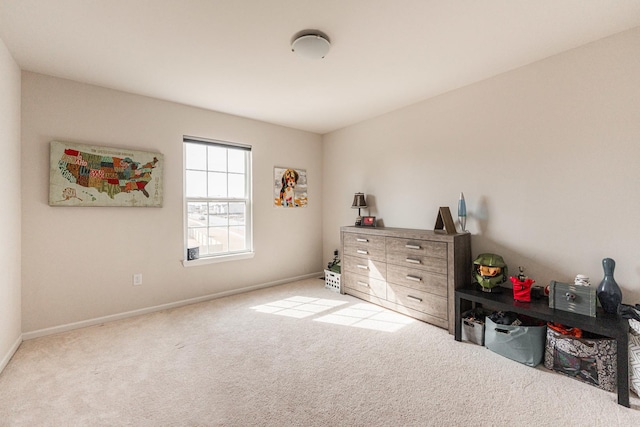 carpeted bedroom featuring baseboards