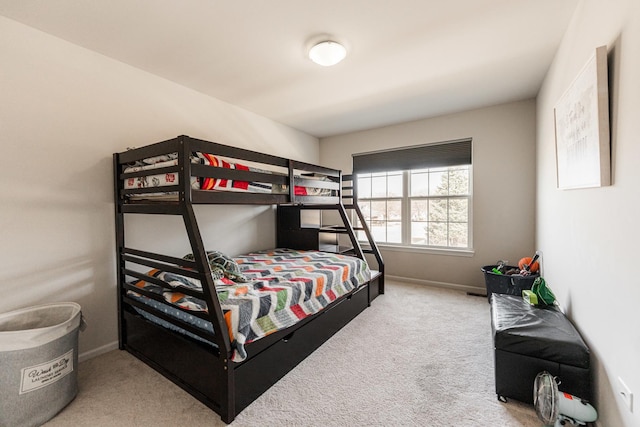 carpeted bedroom with baseboards
