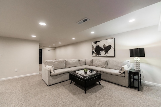 carpeted living area with visible vents, baseboards, and recessed lighting