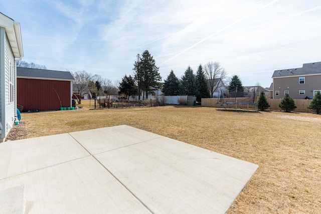 view of patio / terrace with a fenced backyard and a trampoline