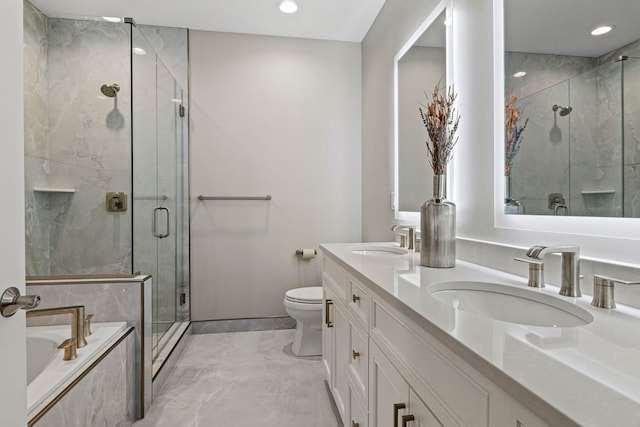 bathroom featuring a bath, marble finish floor, a shower stall, and a sink