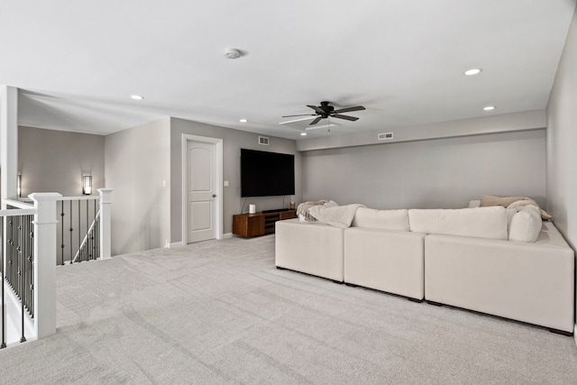 living room with carpet, a ceiling fan, visible vents, and recessed lighting