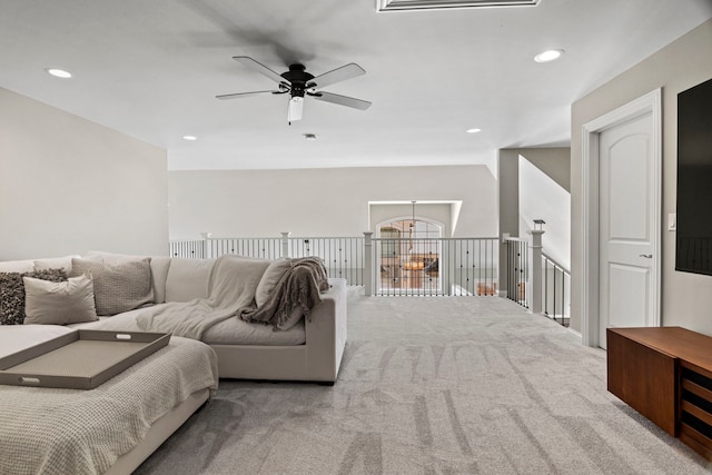 carpeted living area featuring a ceiling fan, visible vents, and recessed lighting