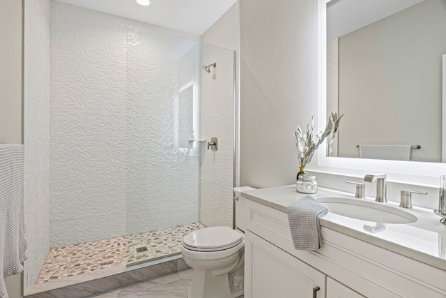 full bathroom with toilet, marble finish floor, vanity, and a walk in shower