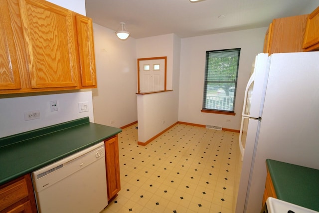3404 Steeplechase Way, Grayslake, IL 60030 - kitchen featuring white appliances, baseboards, light flooring, and dark countertops