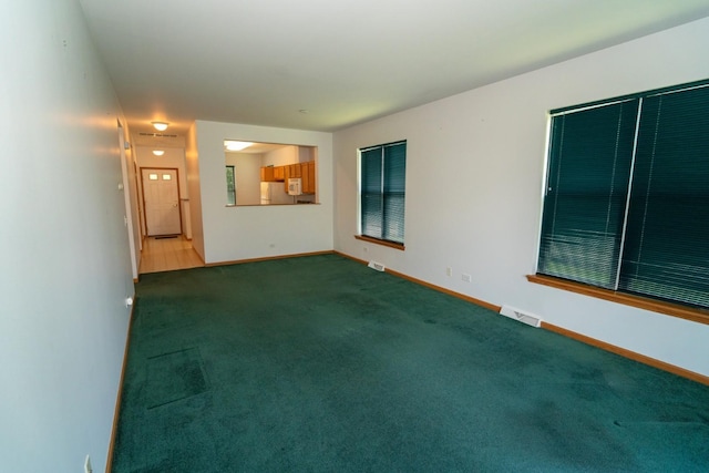 3404 Steeplechase Way, Grayslake, IL 60030 - unfurnished living room featuring carpet flooring and baseboards