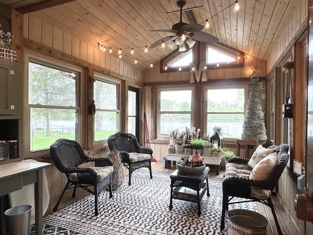 sunroom with vaulted ceiling, wood walls, wooden ceiling, and wood finished floors
