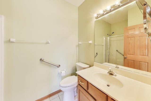 bathroom featuring an enclosed shower, tile patterned floors, toilet, and vanity