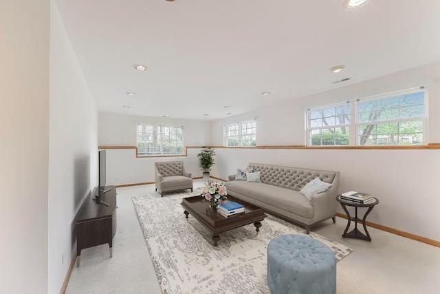 living room with baseboards, recessed lighting, and carpet