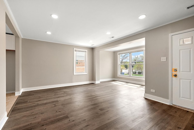 entrance foyer featuring recessed lighting, crown molding, baseboards, and dark wood-style floors
