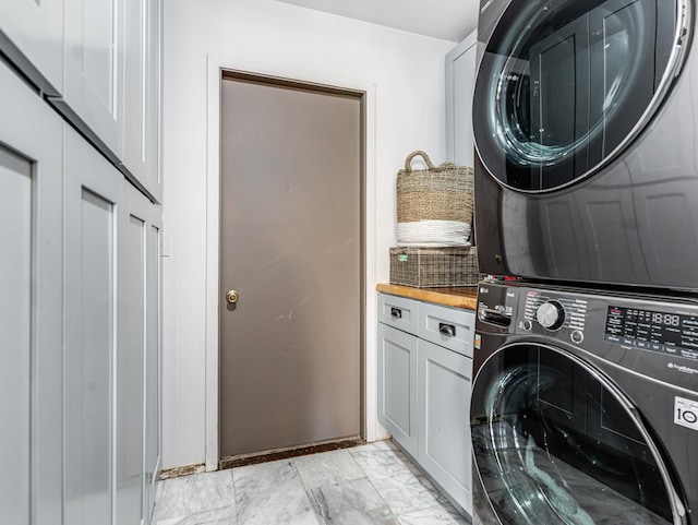 302 Delaware Dr, Bolingbrook, IL 60440 - laundry room with cabinet space and stacked washer and dryer