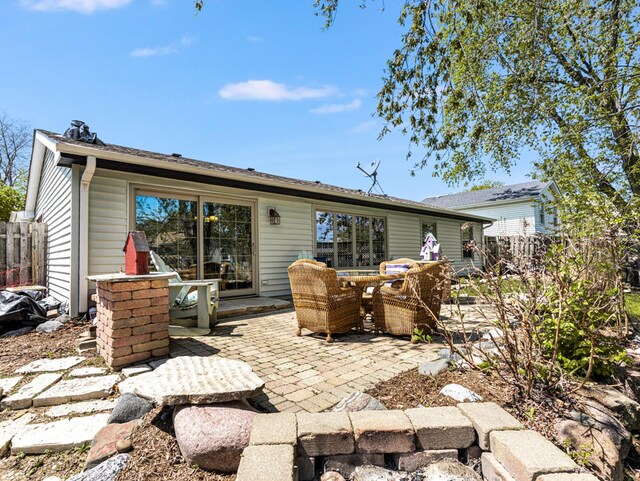 302 Delaware Dr, Bolingbrook, IL 60440 - back of house featuring a patio area, outdoor dining area, and fence