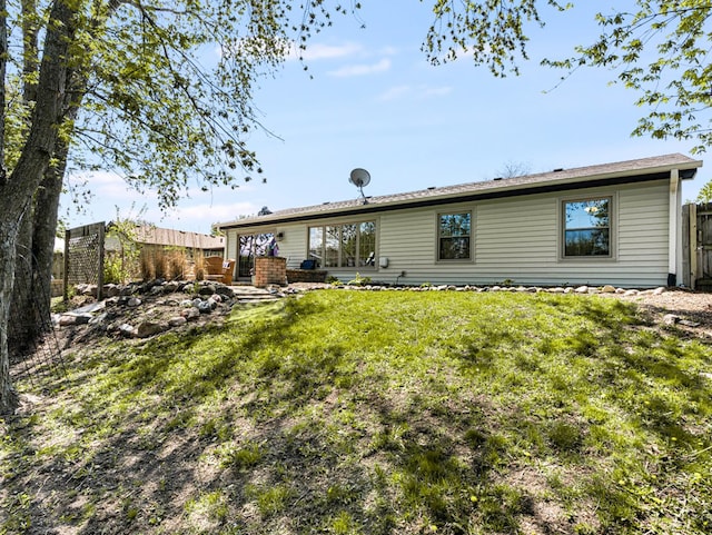302 Delaware Dr, Bolingbrook, IL 60440 - back of property with a fenced backyard and a yard