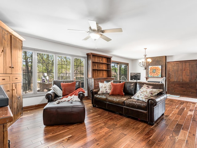 302 Delaware Dr, Bolingbrook, IL 60440 - living room featuring baseboards, ceiling fan with notable chandelier, and dark wood-style floors