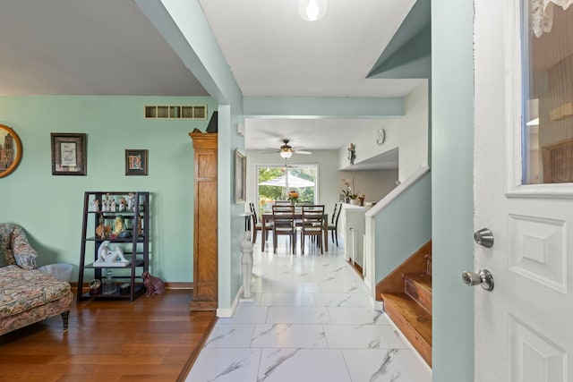 2810 Billie Limacher Ln, Plainfield, IL 60586 - entrance foyer with a ceiling fan, stairway, baseboards, and marble look tile flooring
