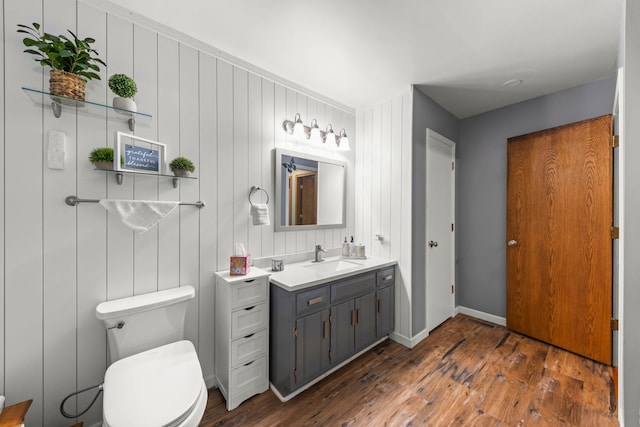2810 Billie Limacher Ln, Plainfield, IL 60586 - bathroom featuring wood-type flooring, toilet, vanity, and baseboards