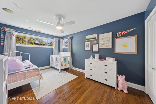 bedroom with baseboards, wood finished floors, and ceiling fan