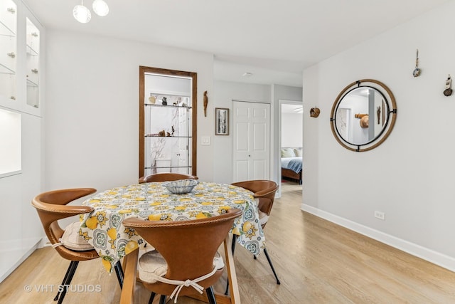 1450 Sandpebble Dr Unit 343, Wheeling, IL 60090 - dining space with light wood-style flooring and baseboards