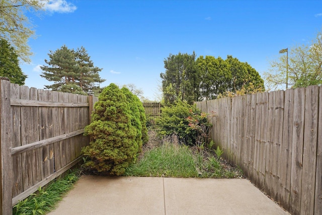 fenced backyard featuring a patio area