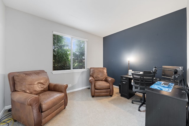 office area with light carpet and baseboards