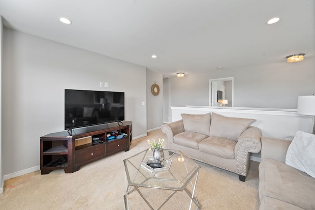carpeted living room featuring baseboards and recessed lighting
