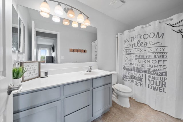 bathroom with toilet, visible vents, curtained shower, tile patterned floors, and vanity