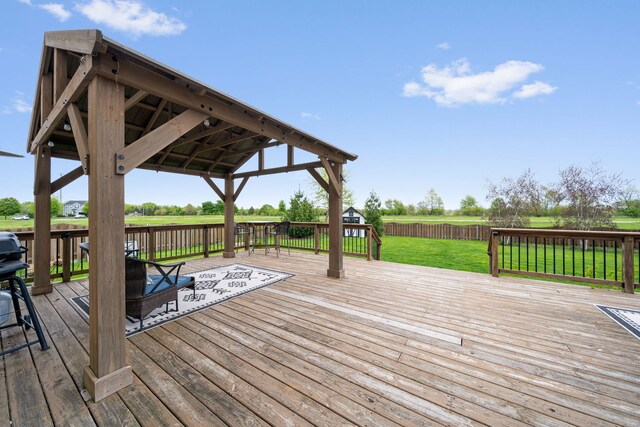 deck featuring a lawn, a gazebo, and a fenced backyard