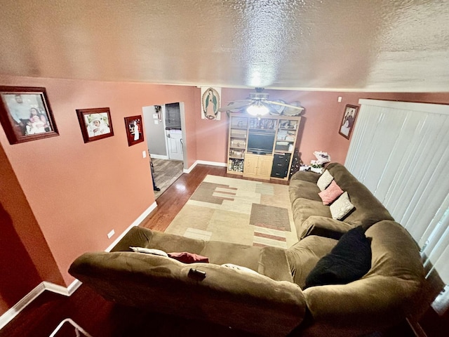 14539 Avers Ave, Midlothian, IL 60445 - living area with baseboards, ceiling fan, wood finished floors, a textured ceiling, and vaulted ceiling