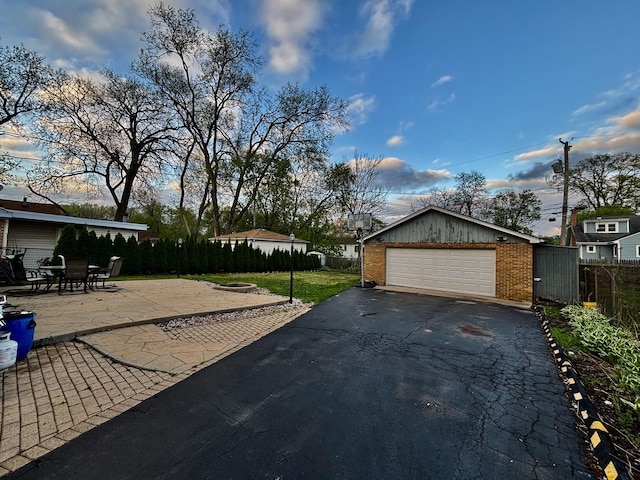 14539 Avers Ave, Midlothian, IL 60445 - garage with fence and asphalt driveway