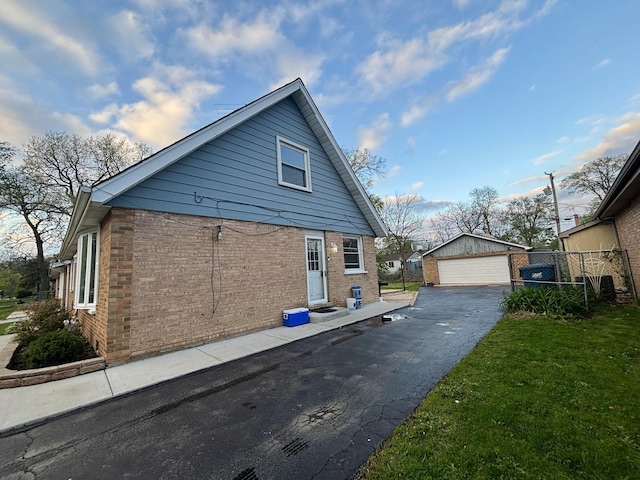 14539 Avers Ave, Midlothian, IL 60445 - view of property exterior featuring brick siding, a garage, and an outbuilding