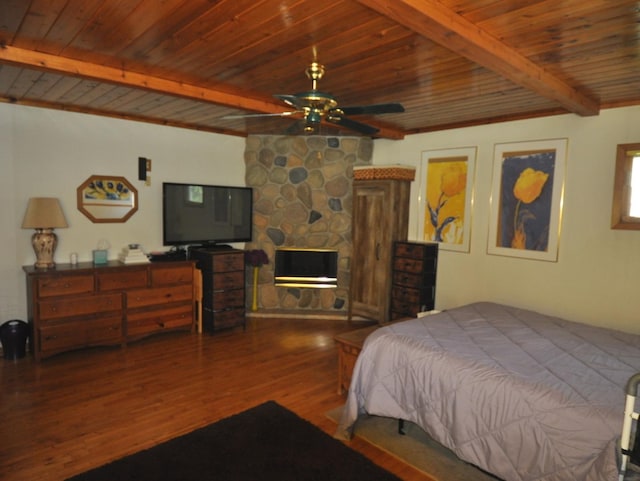 2912 Magellan Dr, Mchenry, IL 60051 - bedroom with wood finished floors, wooden ceiling, beam ceiling, and a fireplace