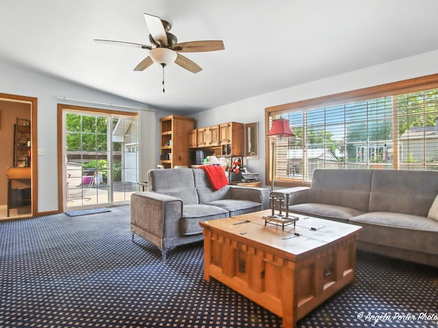 2912 Magellan Dr, Mchenry, IL 60051 - living room with vaulted ceiling, ceiling fan, and dark colored carpet