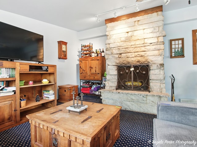 2912 Magellan Dr, Mchenry, IL 60051 - living room with a fireplace and dark colored carpet