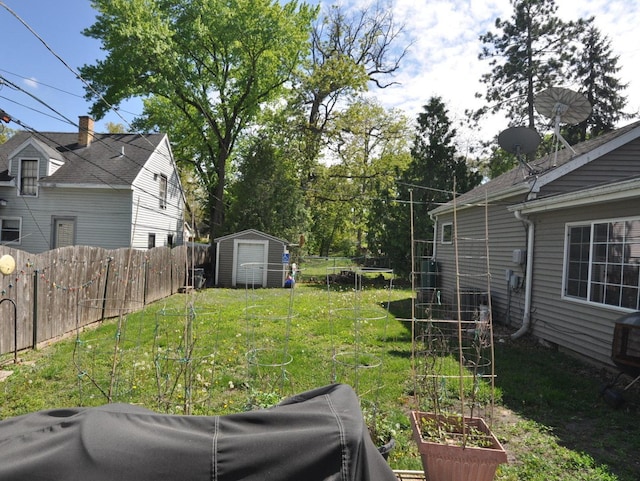 2912 Magellan Dr, Mchenry, IL 60051 - view of yard with a vegetable garden, a shed, and an outbuilding